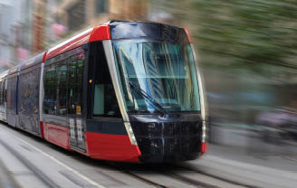 Tram moving through George St in Sydney NSW Australia