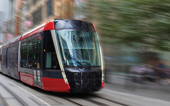 Tram moving through George St in Sydney NSW Australia