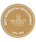A gold circular badge with white text reading Best Residential Development and the years 2014, 2015, featuring the Property Council of Australia logo in the center. Description generated by AI
