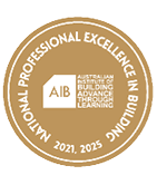 A circular gold emblem with white text reading National Professional Excellence in Building 2021, 2025 surrounding a white house-shaped logo with the letters AIB and the words Australian Institute of Building Advance Through Learning. Description generated by AI