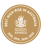 A gold circular emblem with white text stating Best High-Rise in Australia and International Property Awards with years 2013, 2014, 2024, and 2025. Description generated by AI