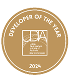 A gold circular badge with white text reading Developer of the Year 2024 and the Urban Development Institute of Australia New South Wales logo in the center. Description generated by AI