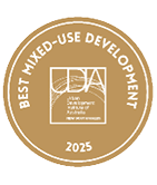 A gold circular badge with white text reading Best Mixed-Use Development 2025 surrounding the Urban Development Institute of Australia New South Wales logo. Description generated by AI