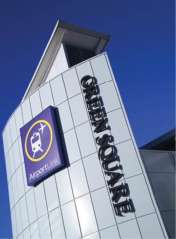 A large building with a sign that says “Open Square" on it. Description generated by AI