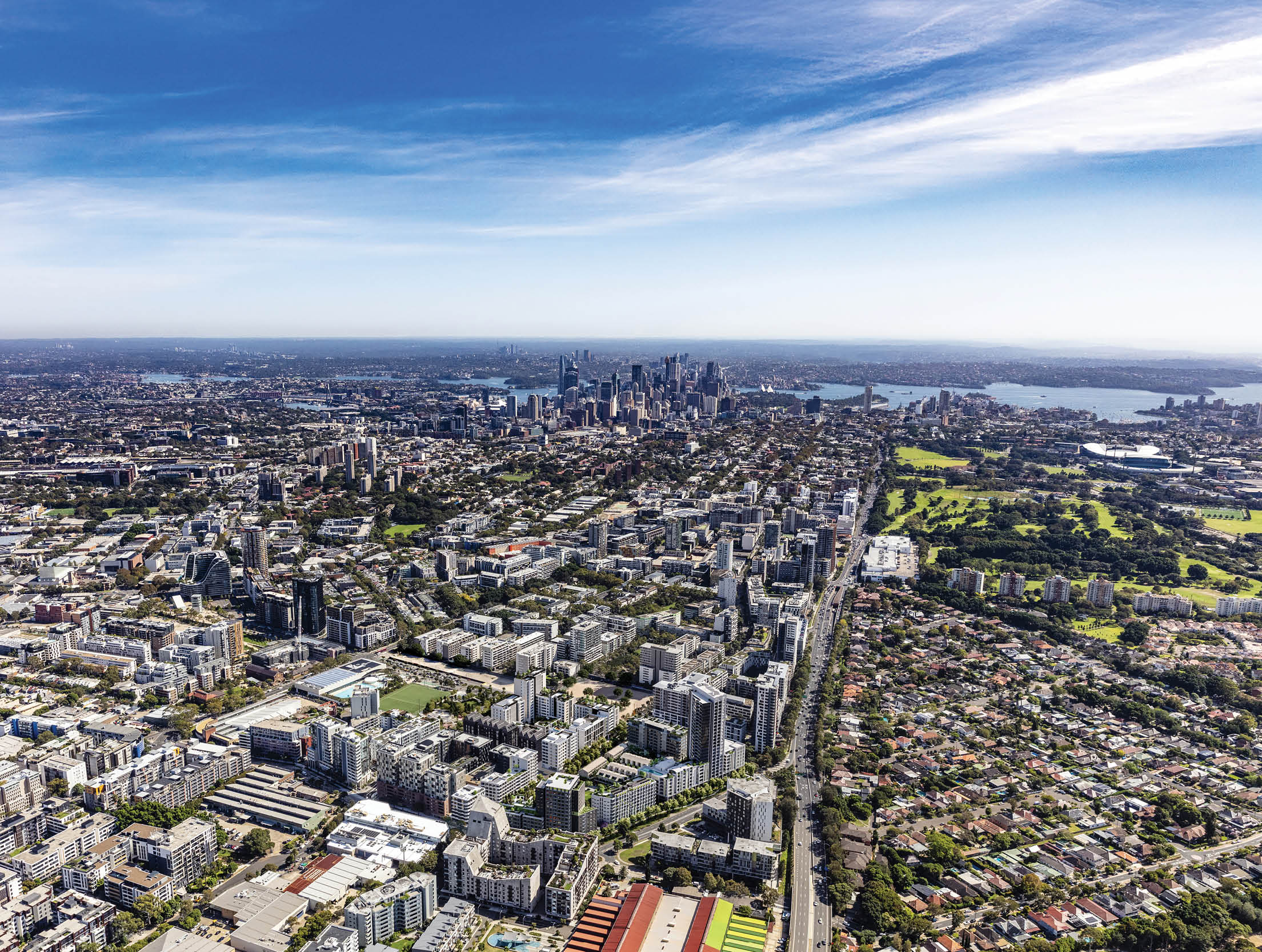A cityscape with a large building and a field. Description generated by AI