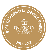 A gold circular badge with white text reading Best Residential Development and the years 2014, 2015, featuring the Property Council of Australia logo in the center. Description generated by AI