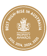 A gold circular emblem with white text stating Best High-Rise in Australia and International Property Awards with years 2013, 2014, 2024, and 2025. Description generated by AI