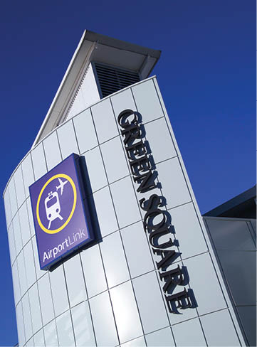 A large building with a sign that says “Open Square" on it. Description generated by AI