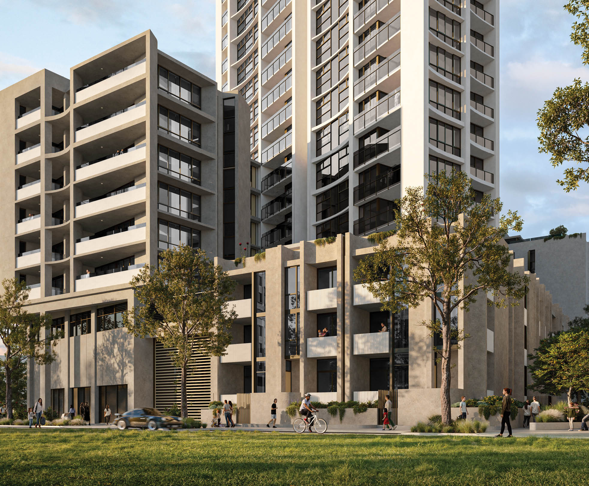 A modern multi-story residential building with balconies and large windows is set against a partly cloudy sky, with people walking and cycling on the sidewalk in front and trees providing greenery. Description generated by AI