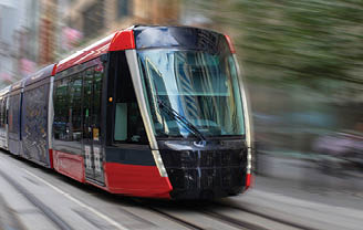 Tram moving through George St in Sydney NSW Australia